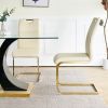 Modern style glass dining table with elegant transparent design, solid support base, pale yellow dining chair set with gold-plated legs, suitable for